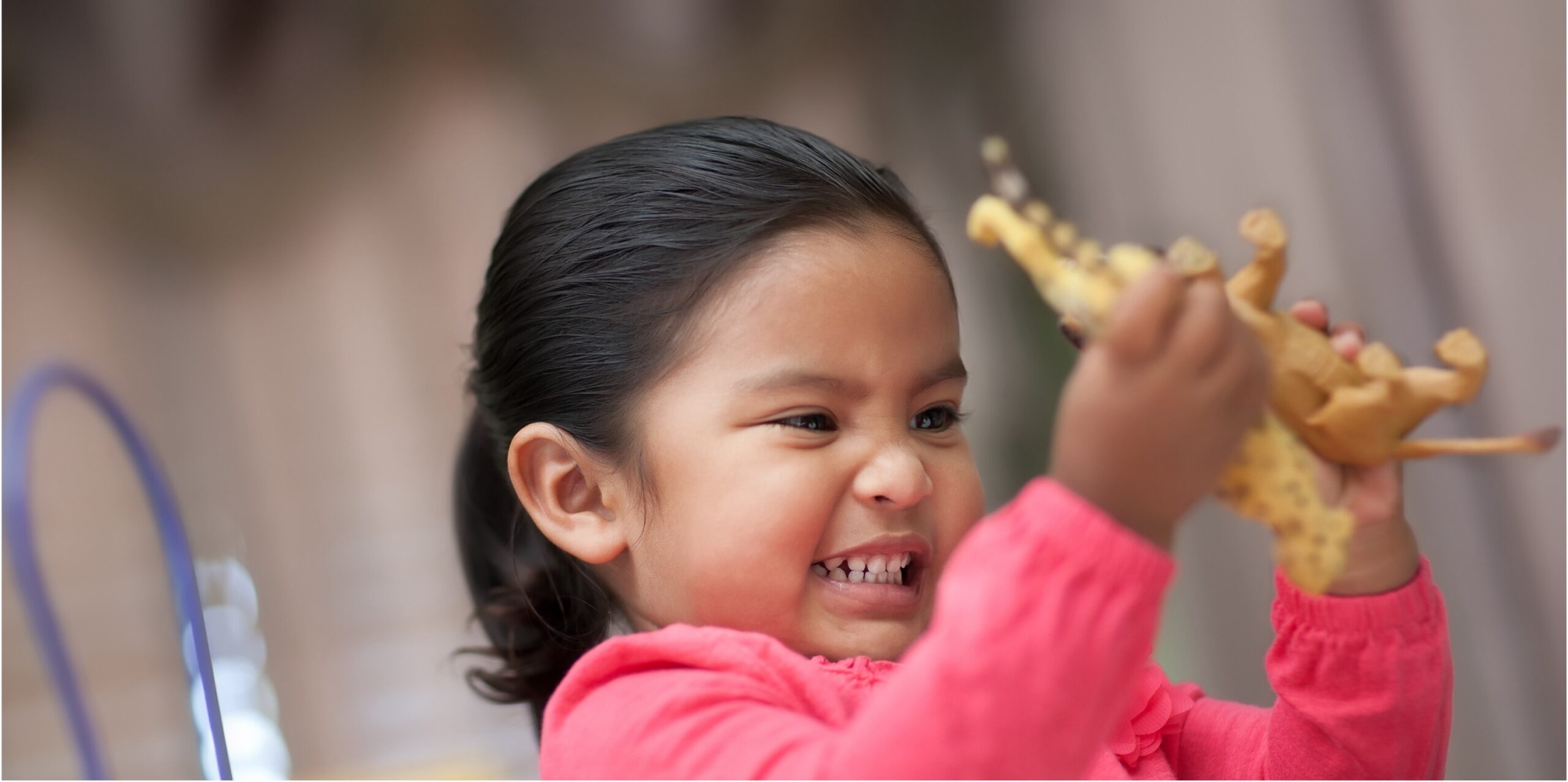 indigenous toddler playing with toy